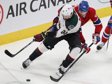 Montreal Canadiens' Joel Armia (40) tries to get to the puck in front of Arizona Coyotes' Jack McBain