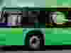 A green Nova Bus electric bus