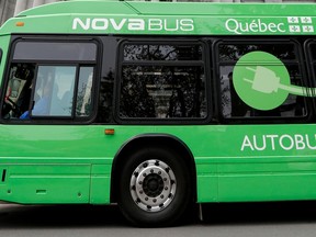 A green Nova Bus electric bus