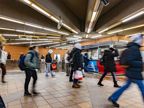Public transit users pass through the Côte-Vertu métro station.