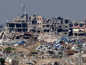 A picture taken from southern Israel shows destroyed buildings in the Gaza Strip on Feb. 7, 2024.