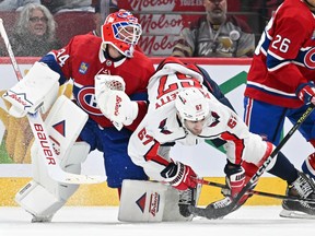 Washington Capitals' Max Pacioretty (67) the skates into Canadiens goaltender Jake Allen at the Bell Centre on Saturday, Feb. 17, 2024, in Montreal.