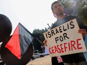 Demonstrators gather with signs during a protest by Israeli left-wing activists against the war in the Gaza Strip and calling for the immediate ceasefire and for the release of the kidnapped hostages, in Tel Aviv on Feb. 27, 2024, amid the ongoing conflict in Gaza between Israel and the Palestinian militant group.