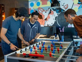 DRW employees building their camaraderie over foosball in its game room. SUPPLIE