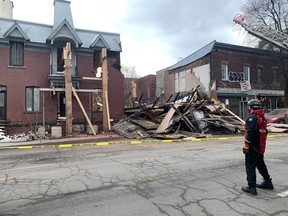 A building between two residences is collapsed.