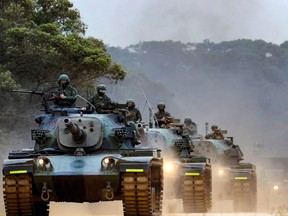 Taiwanese soldiers operating tanks during a drill in an undisclosed location in Taiwan, as China conducts military exercises around the self-ruled island in April 2023.