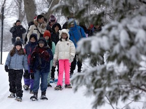 International students studying at the Lester B. Pearson School Board get a taste of winter at Beaver Lake, in Montreal, on Sunday, Feb. 18, 2024.