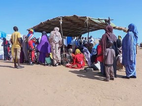 Sudanese refugees gather outside a field hospital in Acre, Chad, Aug. 15, 2023.