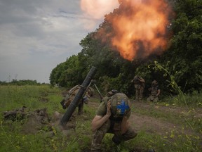 Ukrainian soldiers fire toward Russian positions on the frontline in Zaporizhzhia region, Ukraine, Saturday, June 24, 2023.