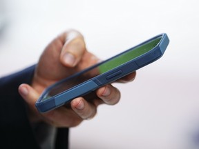Closeup of a hand holding a cellphone
