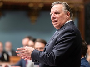François Legault is shown addressing the National Assembly in Quebec City.
