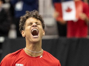 Montrealer Gabriel Diallo celebrates his win against Hong Seong-chan of South Korea during Davis Cup tennis qualifiers in Montreal on Saturday, Feb. 3, 2024.
