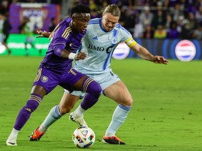 Orlando City forward Ivan Angulo, left, is defended by CF Montréal midfielder Samuel Piette during the first half of an MLS soccer match on Saturday, Feb. 24, 2024, in Orlando.