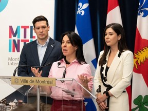 Montreal Mayor Valérie Plante, centre, is flanked by Laval Mayor Stéphane Boyer, left, and Longueuil Mayor Catherine Fournier during a press conference in Montreal, Monday, Feb. 26, 2024.