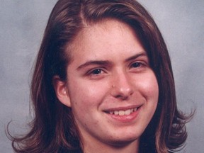 a woman with brown straight hair is seen smiling in this portrait photo.