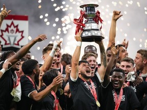 Fourteen clubs, including three newcomers, will take part in the 2024 Canadian Championship, a four-round competition set to kick off in April. Vancouver Whitecaps' Ryan Raposo hoists the Voyageurs Cup after Vancouver defeated CF Montreal 2-1 during the Canadian Championship soccer final, in Vancouver, B.C., Wednesday, June 7, 2023.