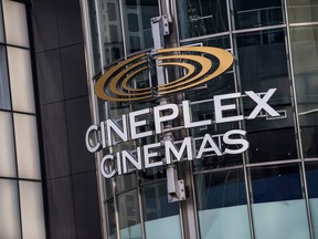 A sign for Cineplex Cinemas on the outside of a glass building