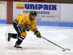 Mike Matheson is seen skating with the puck on his stick adorned in a yellow jersey in this file shot from his time with the Lac St. Louis Lions in 2010.