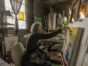 Artist Frances Foster works in her home in Montreal, Friday, Feb. 9, 2024.