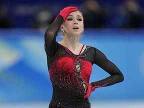 Figure skater Kamila Valieva, of the Russian Olympic Committee, reacts in the women's team free skate program during the figure skating competition at the 2022 Winter Olympics, Monday, Feb. 7, 2022, in Beijing.