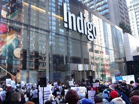 Protesters gather outside an Indigo store in Toronto, on Thursday, Nov. 30, 2023.