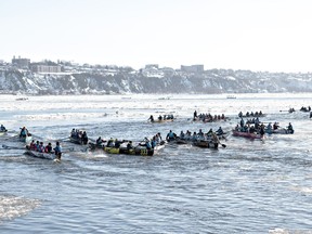 Mild weather forced the Carnaval de Québec to close one of its signature venues on the last day of the 18-day event. Some of the 50 teams take the start of the Carnaval's ice canoe race across the St. Lawrence River in Quebec City, Sunday, Feb. 4, 2024.