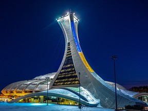 Montreal's Olympic Stadium is lit in blue and yellow in support of Ukraine after Russia's invasion.