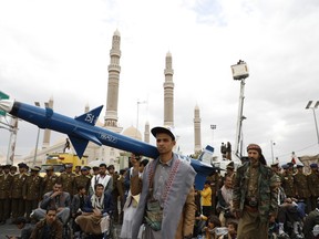 Houthi supporters attend a rally against the U.S.-led strikes against Yemen and in the support of Palestinians in the Gaza Strip, in Sanaa, Yemen, Friday, Feb. 16, 2024.