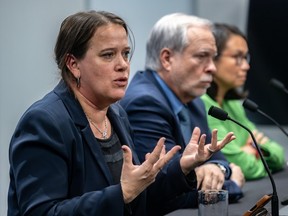 Montreal public health director Dr. Mylène Drouin gestures as she speaks at a news conference alongside Quebec public health director Dr. Luc Boileau and pediatrician, microbiologist and infectious-disease specialist Caroline Quach-Thanh.