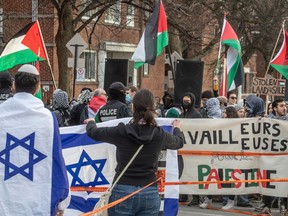 Jewish and pro-Palestinian groups protest outside the Spanish & Portuguese synagogue in Montreal on March 5, 2024.