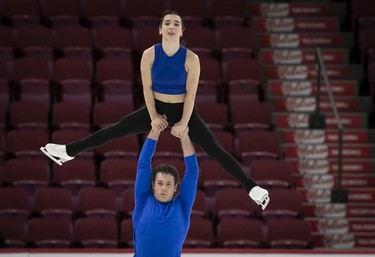 Lia Pereira and Trennt Michaud on the ice during practice of their pairs routine at the Bell Centre on Wednesday, March 6, 2024.