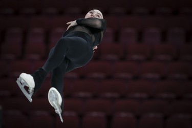 Kelly Ann Laurin is thrown into the air by Loucas Ethier during practice of their pairs routine at the Bell Centre on Wednesday, March 6, 2024.