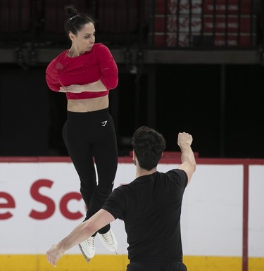 Deanna Stellato-Dudek and Maxime Deschamps on the ice during practice of their pairs routine at the Bell centre on Wednesday, March 6, 2024.