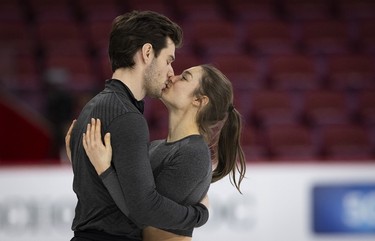 Laurence Fournier Beaudry shares a kiss with partner Nikolaj Soerensen prior to their practice of their ice dance routine at the Bell centre on Wednesday, March 6, 2024.