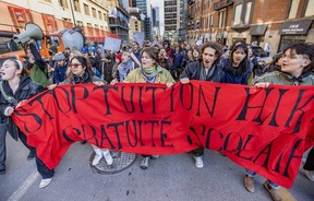 Students march up Guy St. in Montreal on Wednesday, March 13, 2024 in protest against government tuition hikes for out-of-town students.