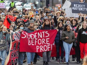 Students march on Shebrooke St. in Montreal on Wednesday, March 13, 2024 to protest against government tuition hikes for out-of-town students.