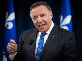Quebec Premier Françcois Legault speaks to reporters.