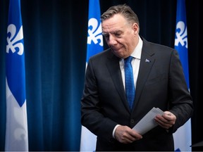 Quebec Premier François Legault leaves a media scrum with head low after meeting with Canadian Prime Minister Justin Trudeau on March 15, 2024.