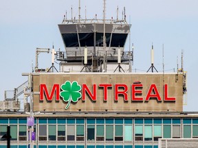 A shamrock replaces the o on the sign atop the terminal at Montréal–Trudeau International Airport in Montreal Tuesday March 16, 2021
