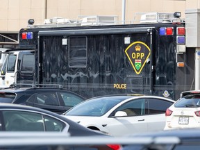 An Ontario Provincial Police command post vehicle is parked outside the Montreal police East Operations Centre in Montreal on Tuesday, March 19, 2024.