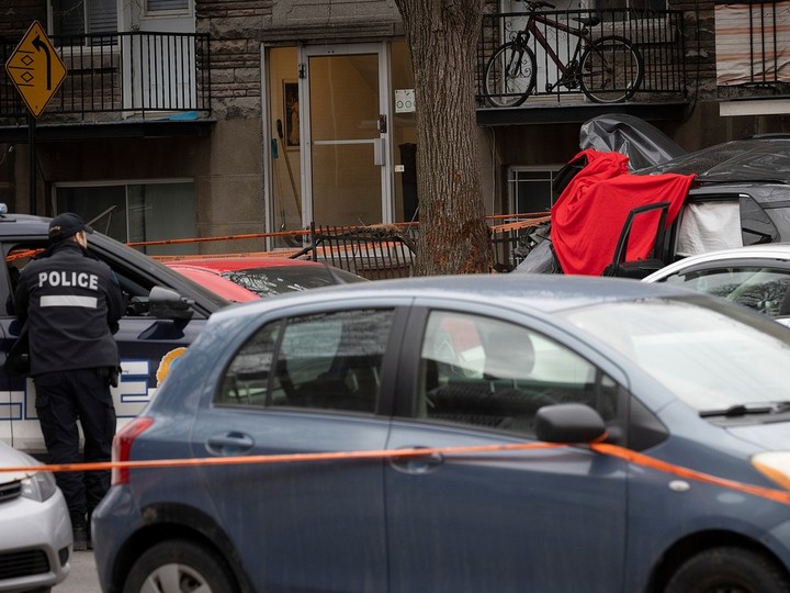  Montreal police investigate the scene of a car crash at the corner of 21 Ave. and St-Zotique March 28, 2024.