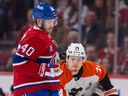 Montreal Canadiens' Joel Armia catches the puck in front of Philadelphia Flyers' Owen Tippett during the first period of a National Hockey League game in Montreal Thursday March 28, 2024.
