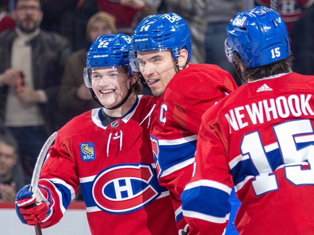 Canadiens players embrace on the ice