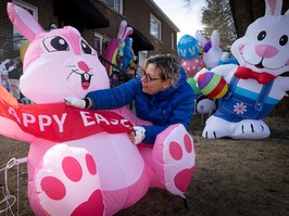 N.D.G. resident Chantal Massicotte puts some finishing touches on Easter decorations on her front lawn on Friday, March 29, 2024.