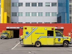 An ambulance outside a hospital complex.