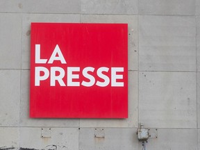 A red square with the words 'LA PRESSE' in it on the side of a building