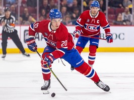 Canadiens' Juraj Slafkovsky skates the puck into the Boston Bruins zone trailed by linemate Nick Suzuki in Montreal on March 14, 2024.