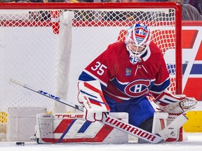 Canadiens goaltender Sam Montembeault makes a pad save on a Bruins shot during third-period action at the Bell Centre Thursday night.