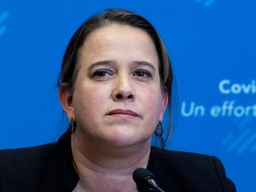 Mylène Drouin looks off to the side during a news conference
