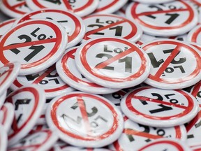 A box of buttons denouncing Bill 21 is shown during a demonstration against the bill in Montreal, Sunday, October 6, 2019.
